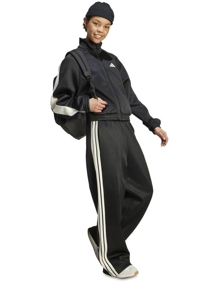 Adidas Stadium Stripes Tracksuit Bottoms in black with signature 3-Stripes, soft recycled polyester-cotton blend, satin piping, and matte rubber-print logo.