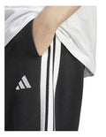 Adidas Essentials 3-Stripes Fleece Loose-Fit Joggers in grey, cozy casual pants with iconic side stripes, made from recycled cotton and polyester blend