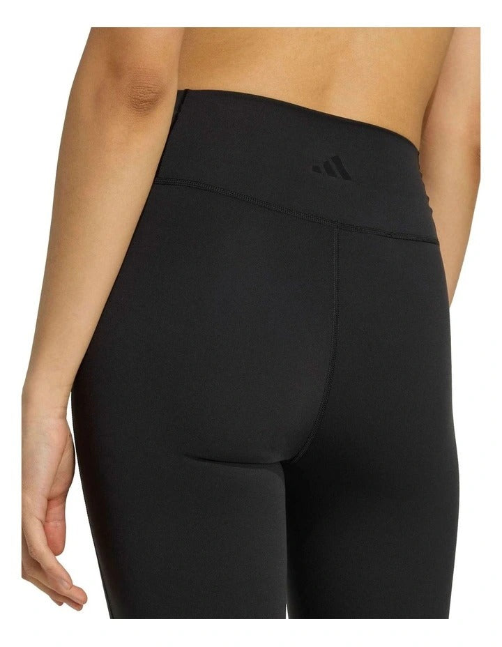 Adidas All Me Essentials Flare Leggings in black, made from 85% recycled polyester and 15% elastane, featuring flared legs and ClimaCool sweat-wicking fabric for gym and studio workouts