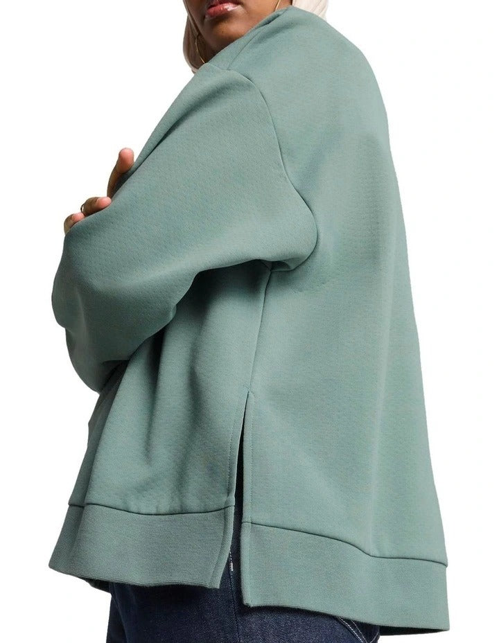 Puma Wardrobe Essentials Oversized Crew Sweatshirt in cotton-polyester blend with centered logo and ribbed cuffs
