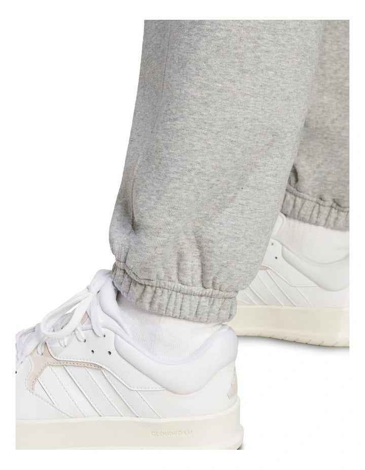 Adidas All SZN Fleece Loose Joggers in cotton and recycled polyester, soft fleece pants with elastic waist and hem, side pockets, and relaxed fit for everyday comfort.