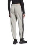 Adidas Essentials 3-Stripes Fleece Loose-Fit Joggers in grey, cozy casual pants with iconic side stripes, made from recycled cotton and polyester blend