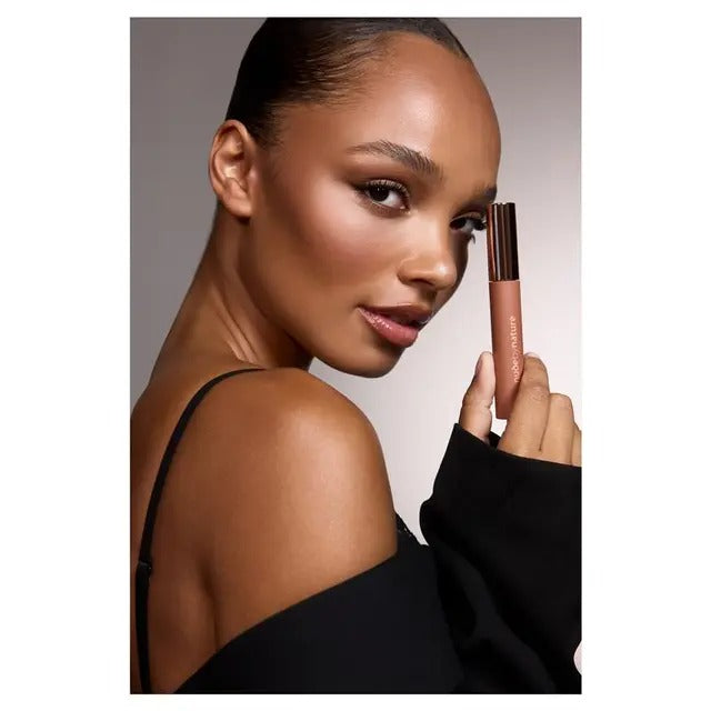 Nude by Nature black mascara for lifted, curled lashes.