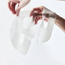 Lavvish Bio Collagen Face Mask set of 5 in elegant pink packaging displayed on marble surface with skincare accessories